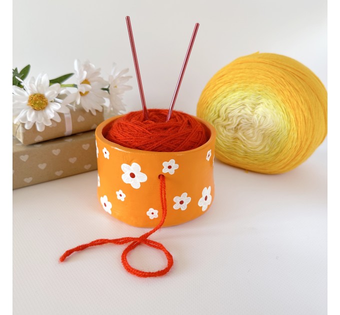 Small orange crochet yarn holder bowl with retro daisy flowers Knitter gifts