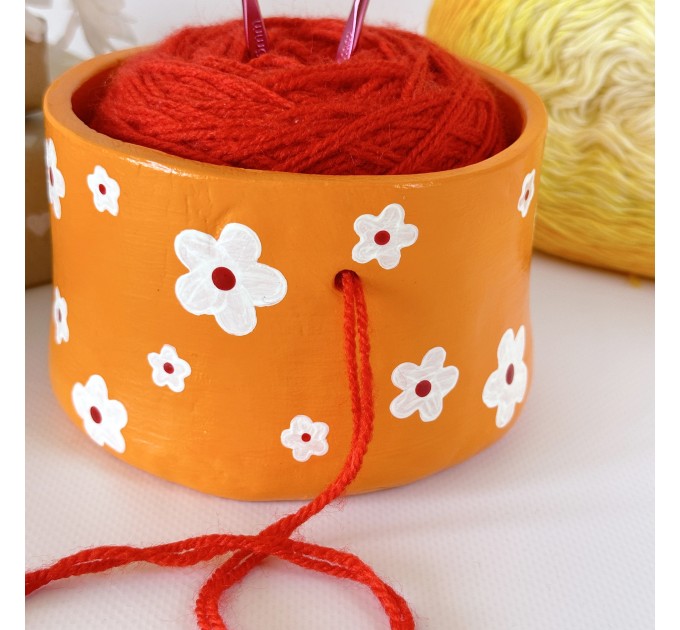 Small orange crochet yarn holder bowl with retro daisy flowers Knitter gifts