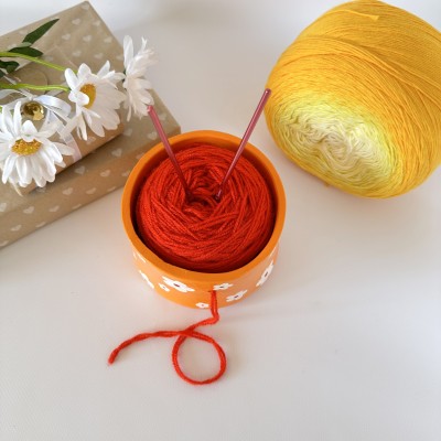 Small orange crochet yarn holder bowl with retro daisy flowers Knitter gifts