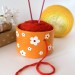 Small orange crochet yarn holder bowl with retro daisy flowers Knitter gifts