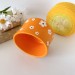 Small orange crochet yarn holder bowl with retro daisy flowers Knitter gifts