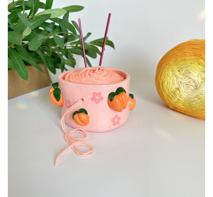 Small crochet yarn bowl with peach and daisy flowers and daisy flowers