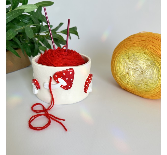 Small milky crochet yarn bowl with amanita mushrooms