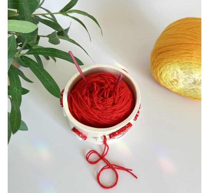 Small milky crochet yarn bowl with amanita mushrooms