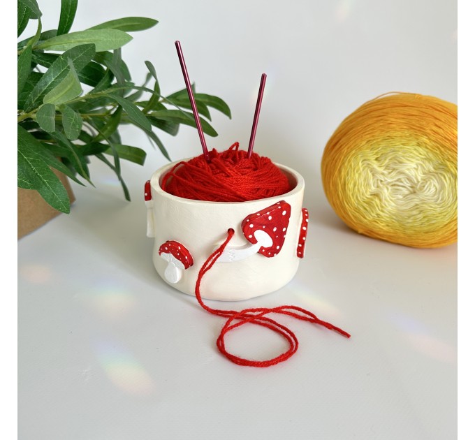 Small milky crochet yarn bowl with amanita mushrooms