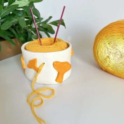 Small crochet yarn bowl with chanterelle mushrooms