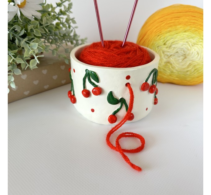 Small milky white crochet yarn holder bowl with red cherries and dots Knitters crocheters