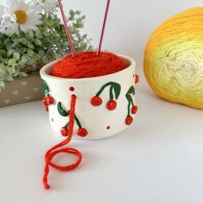 Small milky white crochet yarn holder bowl with red cherries and dots Knitters crocheters