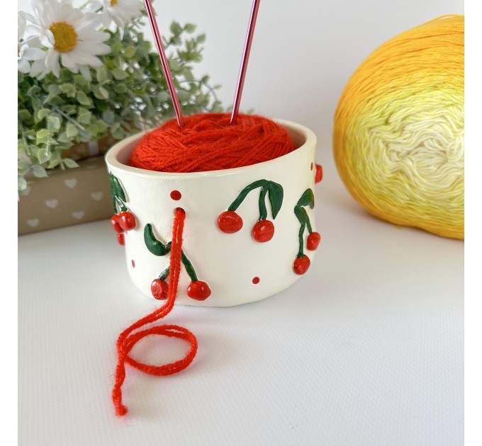 Small milky white crochet yarn holder bowl with red cherries and dots Knitters crocheters