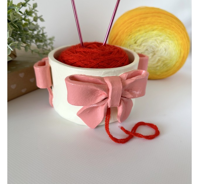 Small milky white crochet yarn holder bowl with pink coquette bows Knitters crocheters